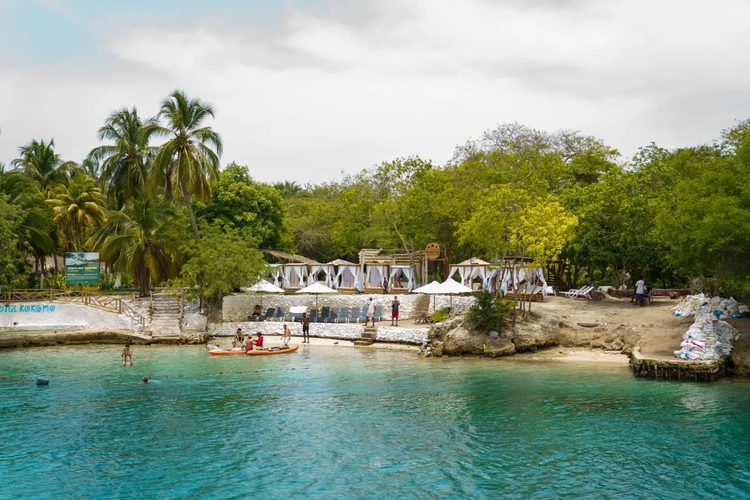 A quiet cove with cabanas on a Rosario Islands day trip